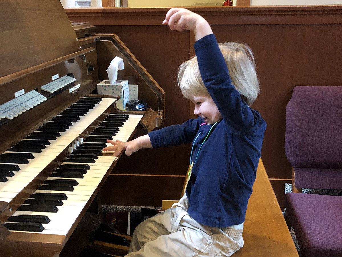 little boy at piano